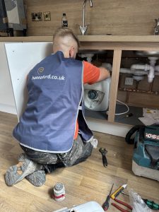 Joe hard at it, finishing off the kitchens in Phase 1